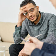 man looking at the pen of another man