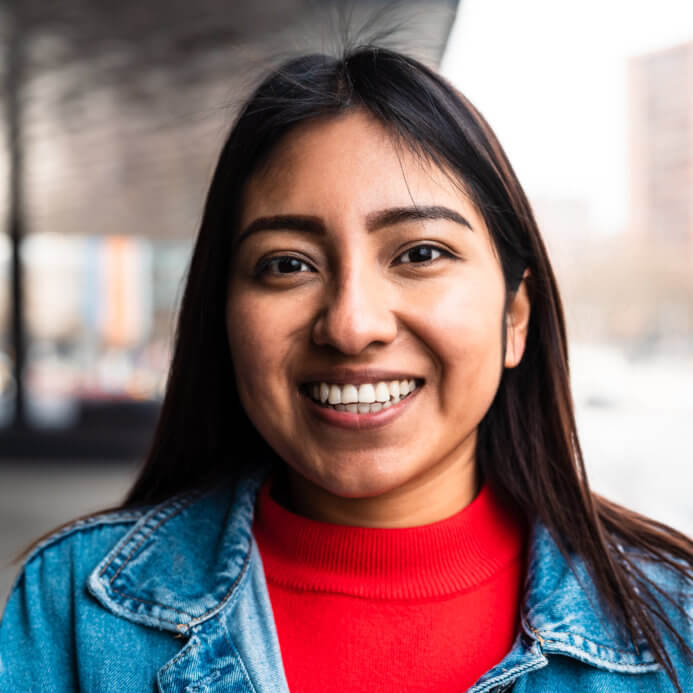 Happy native American young woman smiling in camera